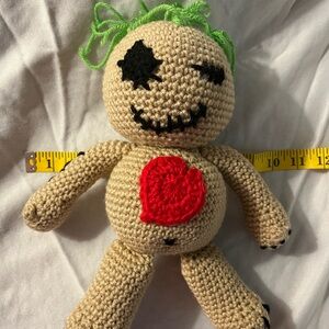 Voodoo Doll doesn’t come with pins. Hand crochet with acrylic yarn 13 1/2 inch.